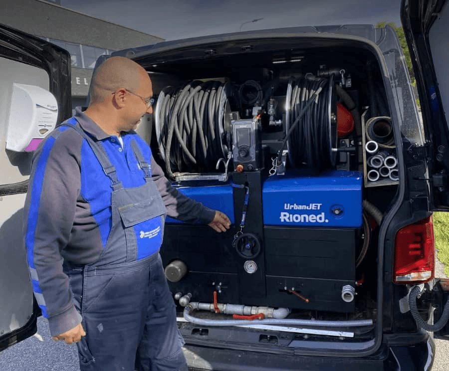 Rachid Ghazil, founder of MMA Plumbing, beside his service van loaded with Rioned UrbanJET drain-cleaning equipment
